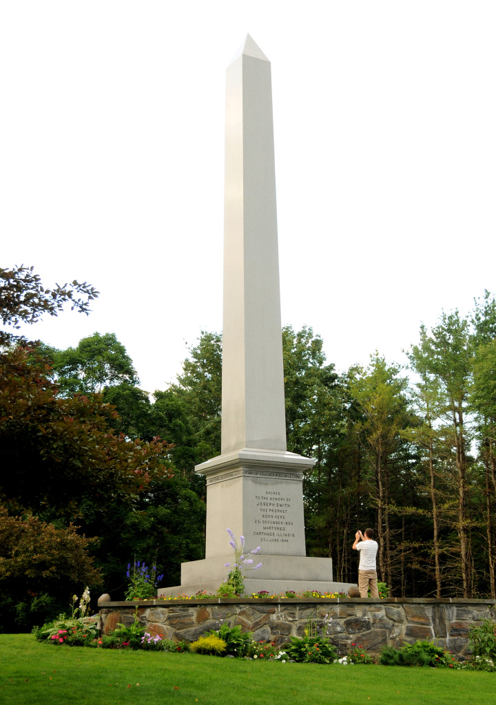 A visitor reads the inscriptions on the Joseph Smith monument, Sharon, Vermont.