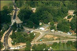 Aerial photograph showing the final stages of the road relocation project in the Kirtland flats area. The road project was funded in part by the Mormon Historic Sites Foundation in cooperation with The Church of Jesus Christ of Latter-day Saints. The entire Kirtland renovation project is expected to be completed by 2003. Photograph by Karl Ricks Anderson.