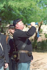 Bugler Matthew Carling plays "Colors" at the opening ceremonies of celebration, as William Prescott looks on. Photo by Carrie Mauriello Crozer