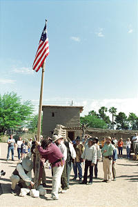  Hoisting a U.S. flag representing the era, the "Meadows Missionaries of 1855" re-enact the posting of colors during the 150-year celebration. Photo by Carrie Mauriello Crozer