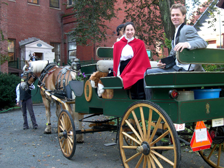 Nicole Benvie, portraying Vilate Young, and Fred Brown, portraying Brigham Young, arrive in horse-drawn carriage during the plaque dedication ceremony. Right is view of the Nathaniel Felt home as part of the Peabody-Essex Museum campus. Photo courtesy Jonathan Felt